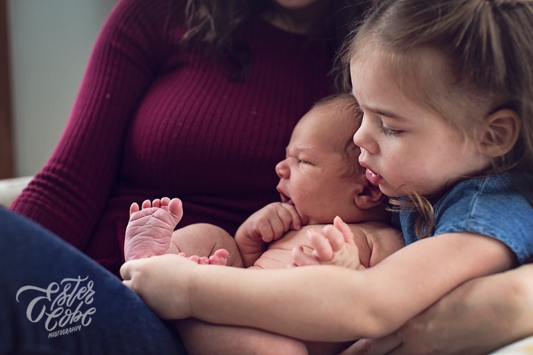 Checking out baby Newborn in Home Photography
